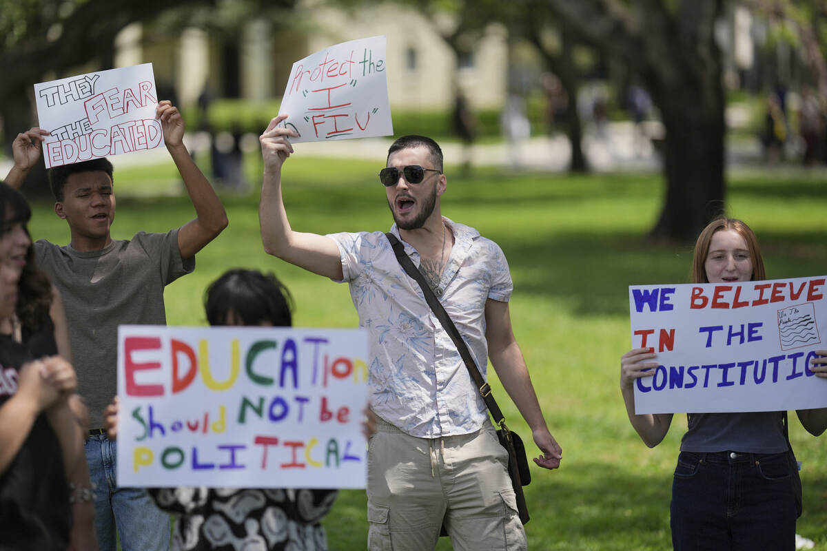A group of Florida International University students protest against cuts in federal funding an ...