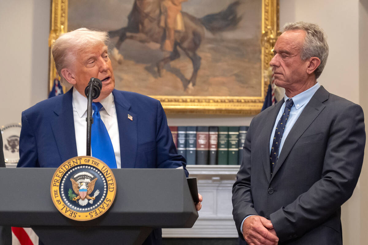FILE - President Donald Trump, from left, speaks as Health and Human Services Secretary Robert ...