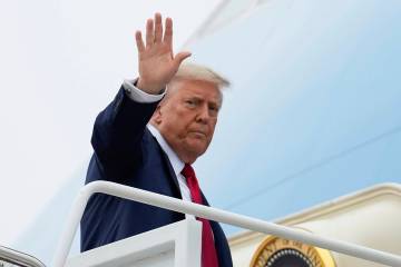 President Donald Trump waves as he boards Air Force One, Sunday, June 15, 2025, at Joint Base A ...