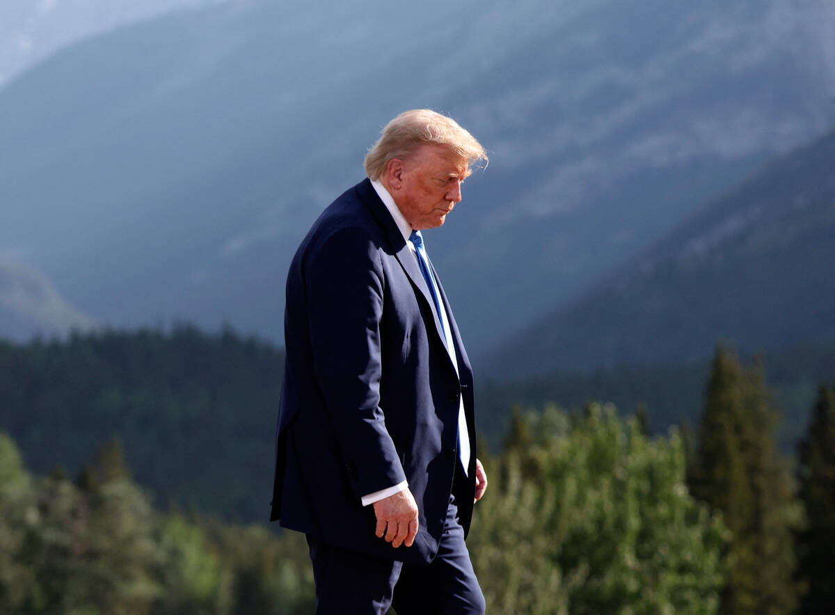 U.S. President Donald Trump leaves after a family photo session during the G7 Summit, in Kanana ...