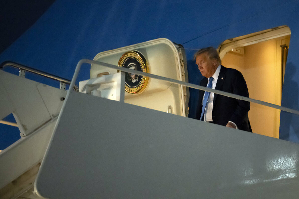 President Donald Trump steps off Air Force One after at Joint Base Andrews, Md., on Tuesday, Ju ...