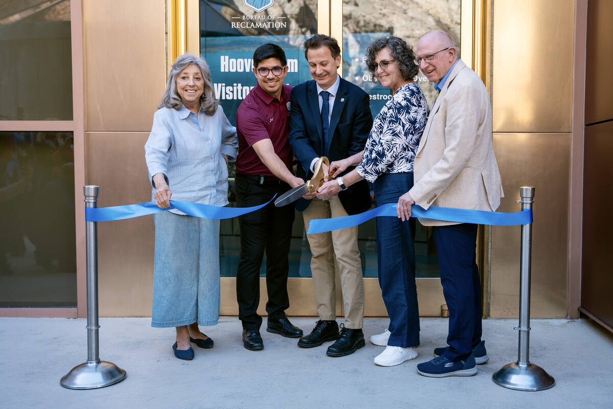 Key officals hold a ribbon cutting ceremony to honor the opening of the newly renovated Hoover ...