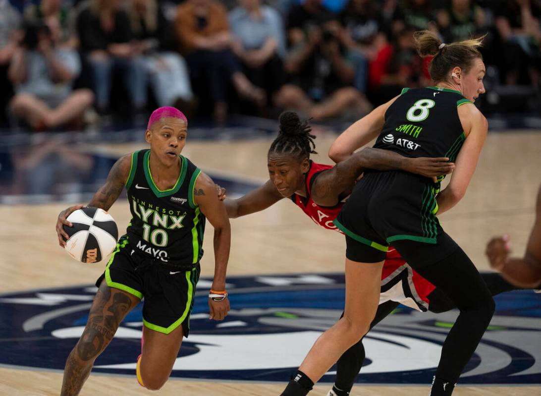 Minnesota Lynx forward Alanna Smith (8) draws an offensive foul on Las Vegas Aces guard Jewell ...