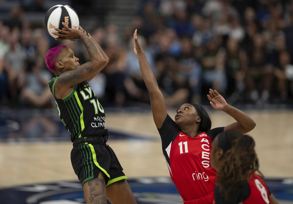 Minnesota Lynx guard Courtney Williams (10) shoots a three-pointer over the defense of Las Vega ...