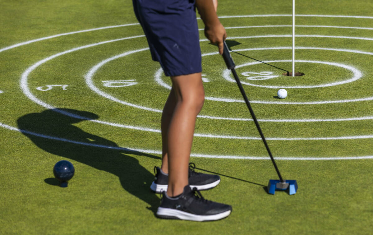 Cruz Shirey, 7, putts to the pin during qualifying for the Drive, Chip and Putt competition tha ...