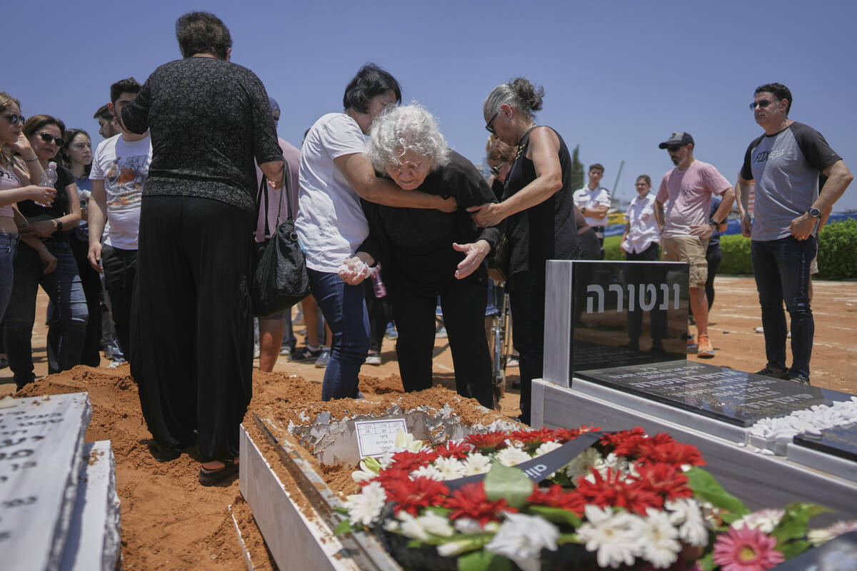 Relatives and friends of Daisy Yitzhaki, 85, who was killed during an Iranian missile attack, m ...