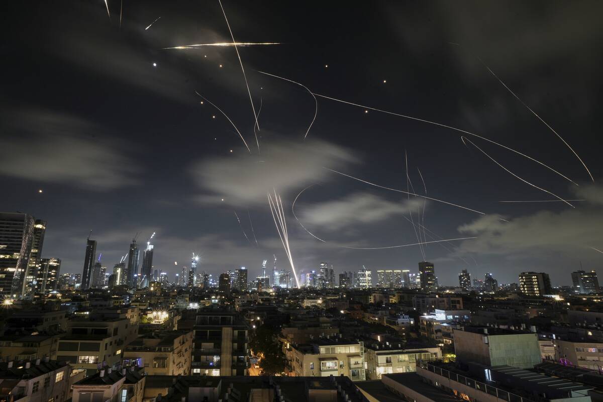 The Israeli Iron Dome air defense system fires to intercept missiles during an Iranian attack o ...