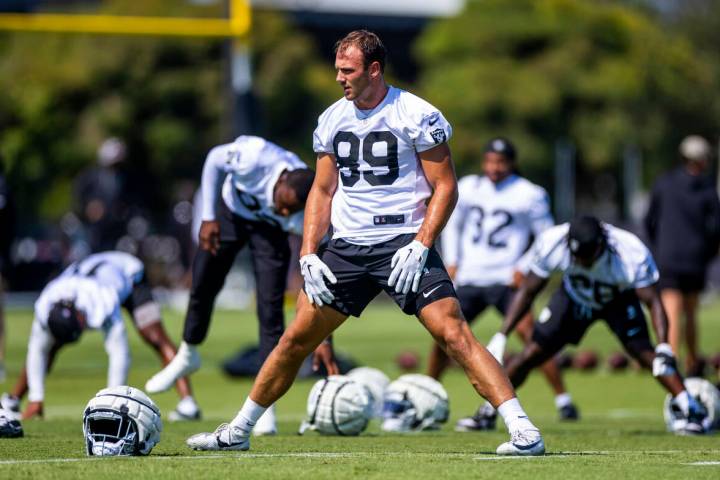 Raiders tight end Brock Bowers (89) stretches with teammates during the second day of Raiders t ...