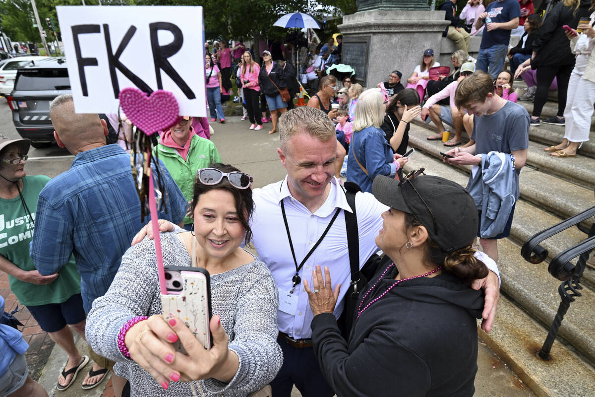 Blogger Aidan Kearney, center, meets with fans and Karen Read supporters, from left, Linda Alle ...
