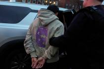 FILE - Deportation officers with Enforcement and Removal Operations in U.S. Immigration and Cus ...