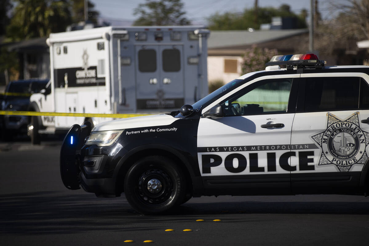 Metropolitan Police Department officers investigate the scene of a homicide at the 3600 Block o ...