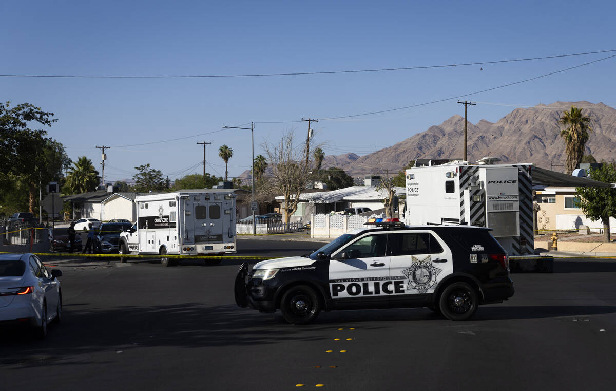 Metropolitan Police Department officers investigate the scene of a homicide at the 3600 Block o ...