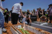Relatives and friends of Daisy Yitzhaki, 85, who was killed during an Iranian missile attack, m ...