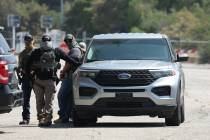 ICE agents stage outside Gate E of Dodger Stadium on Thursday, June 19, 2025. Sporadic immigrat ...