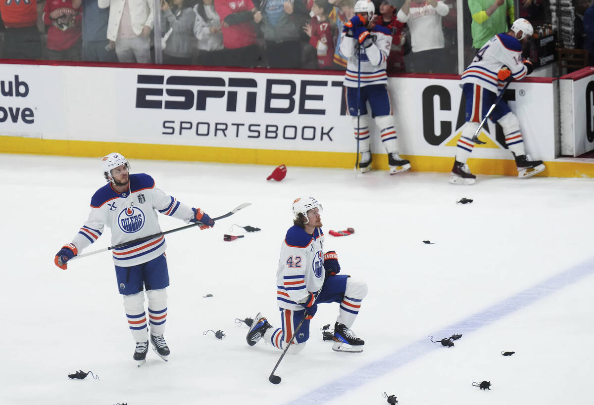 Edmonton Oilers' Mattias Janmark (13) and Kasperi Kapanen (42) look on as the Florida Panthers ...