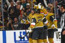 Golden Knights center Tomas Hertl, left, celebrates a last-second goal by Golden Knights center ...