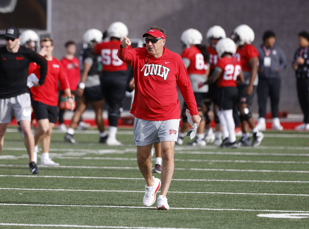 UNLV football head coach Dan Mullen whistles to signal the start of team practice, on Thursday, ...