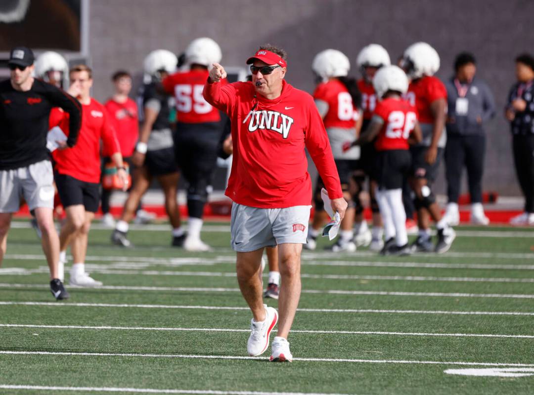 UNLV football head coach Dan Mullen whistles to signal the start of team practice, on Thursday, ...