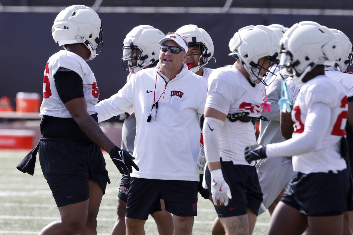 UNLV football head coach Dan Mullen instructs his players during football spring practice at th ...