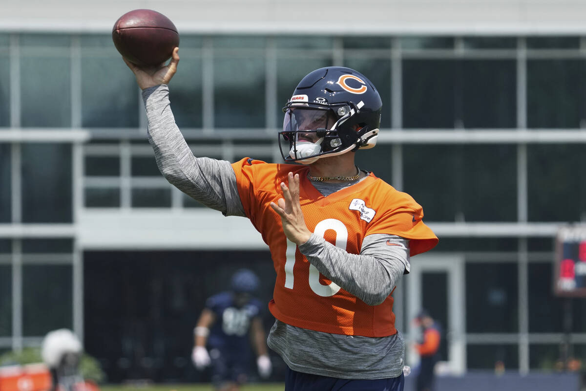 Chicago Bears quarterback Caleb Williams throws a ball during NFL football practice at Halas Ha ...