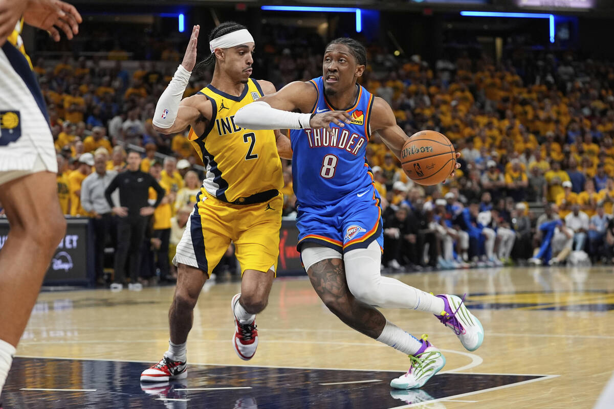 Oklahoma City Thunder forward Jalen Williams (8) drives on Indiana Pacers guard Andrew Nembhard ...