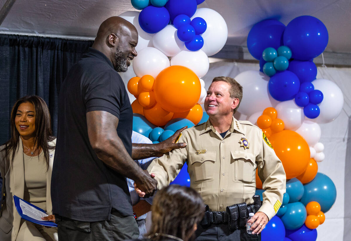 Shaquille O’Neal greets Sheriff Kevin McMahill as he arrives for a press conference and ...