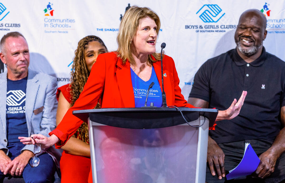 Tami Hance-Lehr with Communities In Schools of Nevada speaks while joined by local leaders and ...