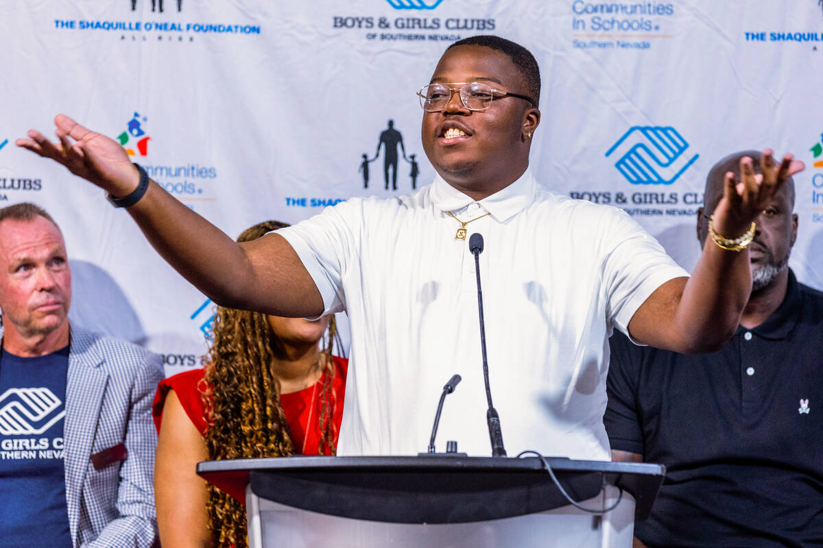 X'Zavier Webb, a Communities In Schools of Nevada alumnus, speaks while joined by local leaders ...