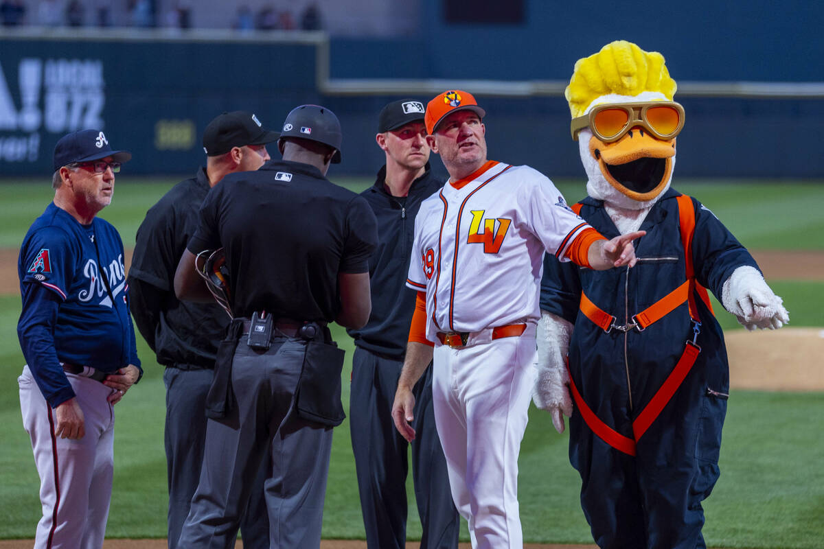 Aviators manager Fran Riordan and Spruce the Goose look to the crowd before the opening day bas ...