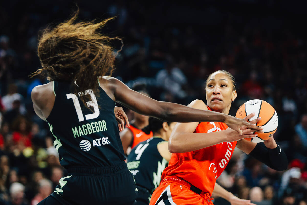 Seattle Storm forward Ezi Magbegor (13) guards Aces center A'ja Wilson (22) during a WNBA baske ...