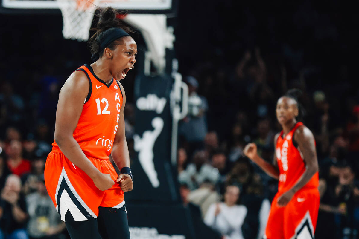 Aces guard Chelsea Gray (12) celebrates during a WNBA basketball game between the Aces and the ...