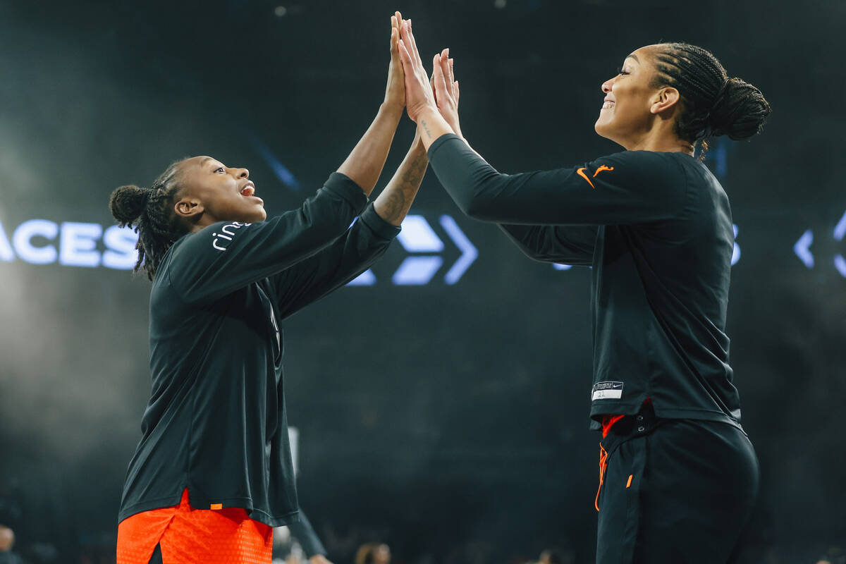 Aces guard Jewell Loyd, left, does her pre-game ritual with Aces center A'ja Wilson during a WN ...
