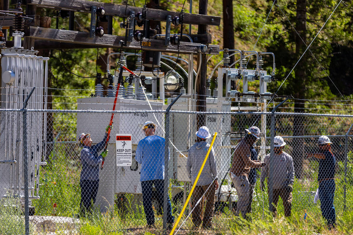 NV Energy and Gen-Tech crews work at the Kyle Canyon Substation as they prepare for a possible ...