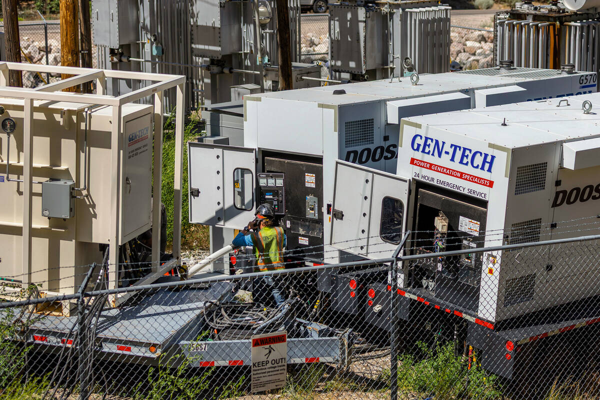 NV Energy and Gen-Tech crews work at the Kyle Canyon Substation as they prepare for a possible ...