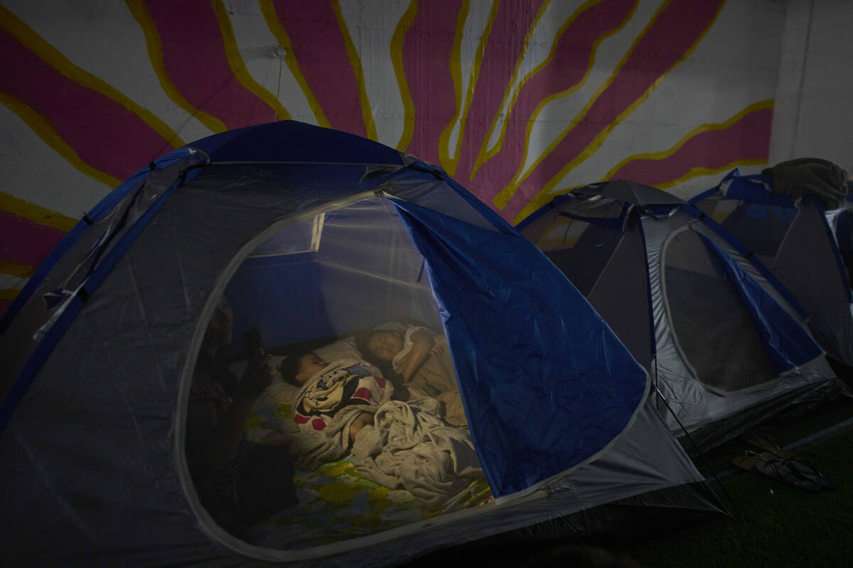 People spend the night in a public shelter as a precaution against possible Iranian missile att ...