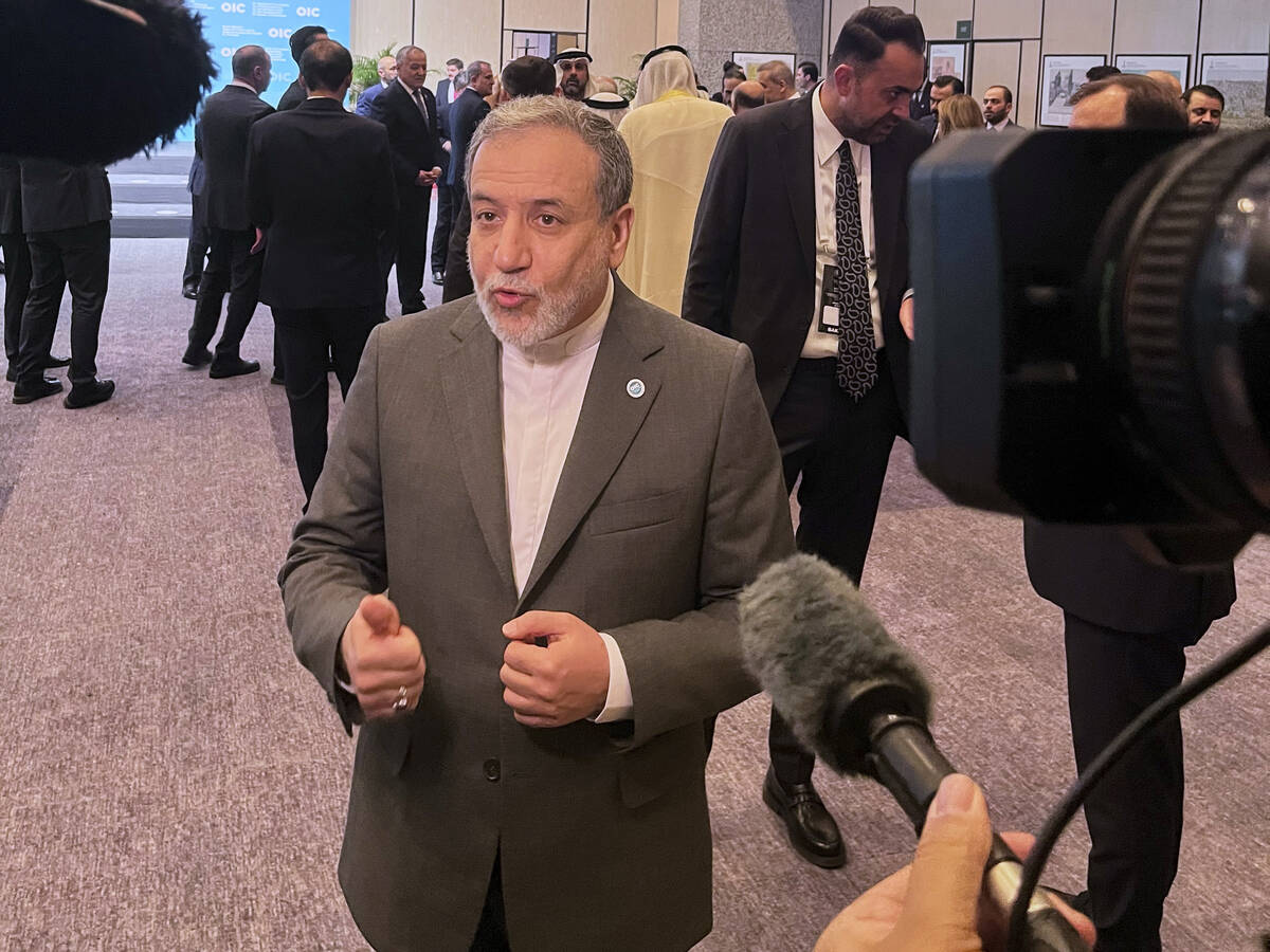 Iranian Foreign Minister Abbas Araghchi speaks to the media as he arrives to the Council of For ...