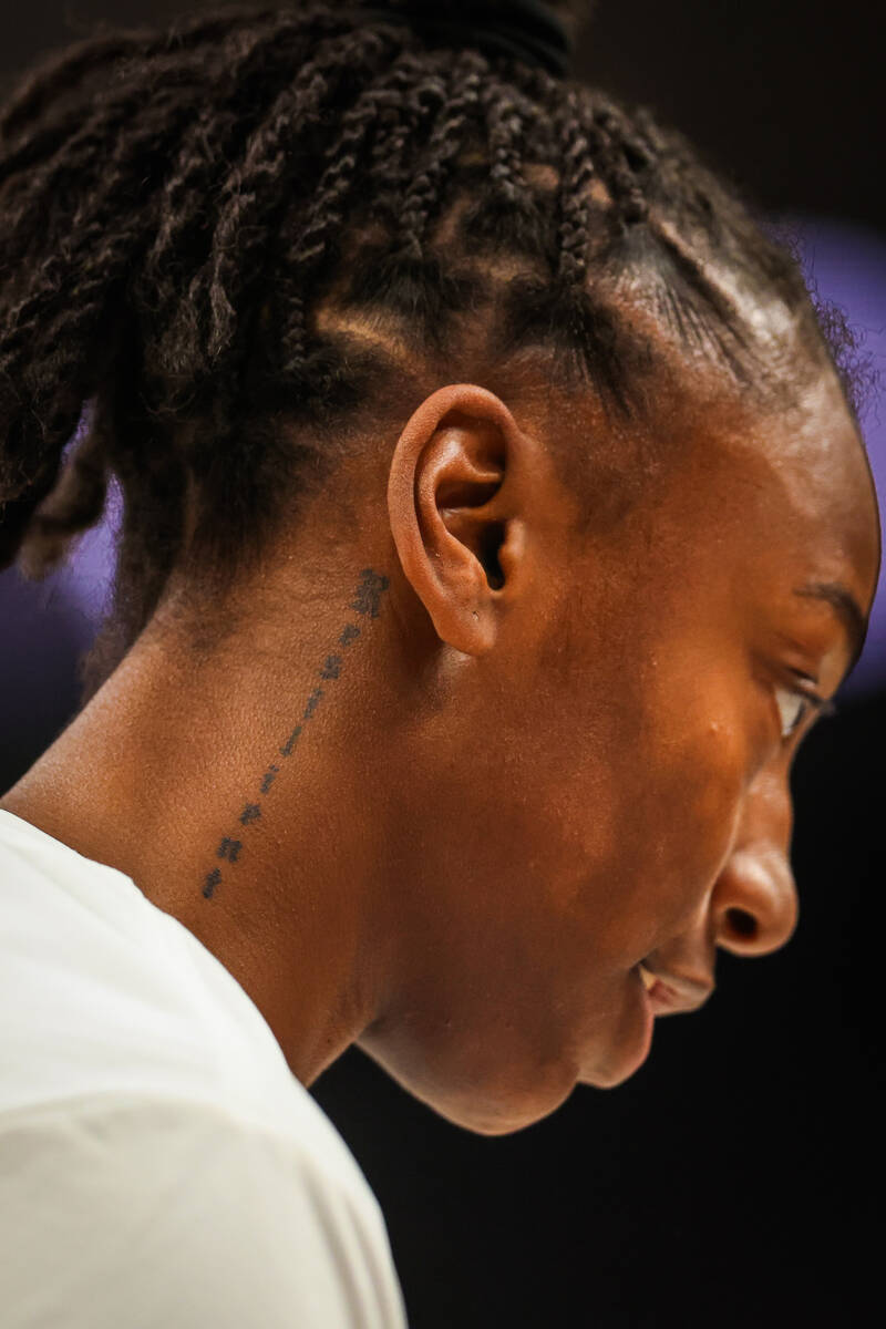 Aces guard Jewell Loyd’s “resilient” tattoo during a WNBA basketball game ...