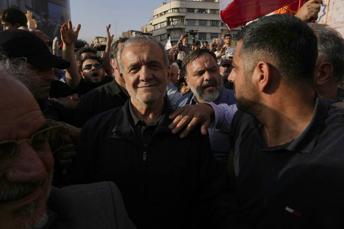 Iranian President Masoud Pezeshkian attends a protest following the U.S. attacks on nuclear sit ...