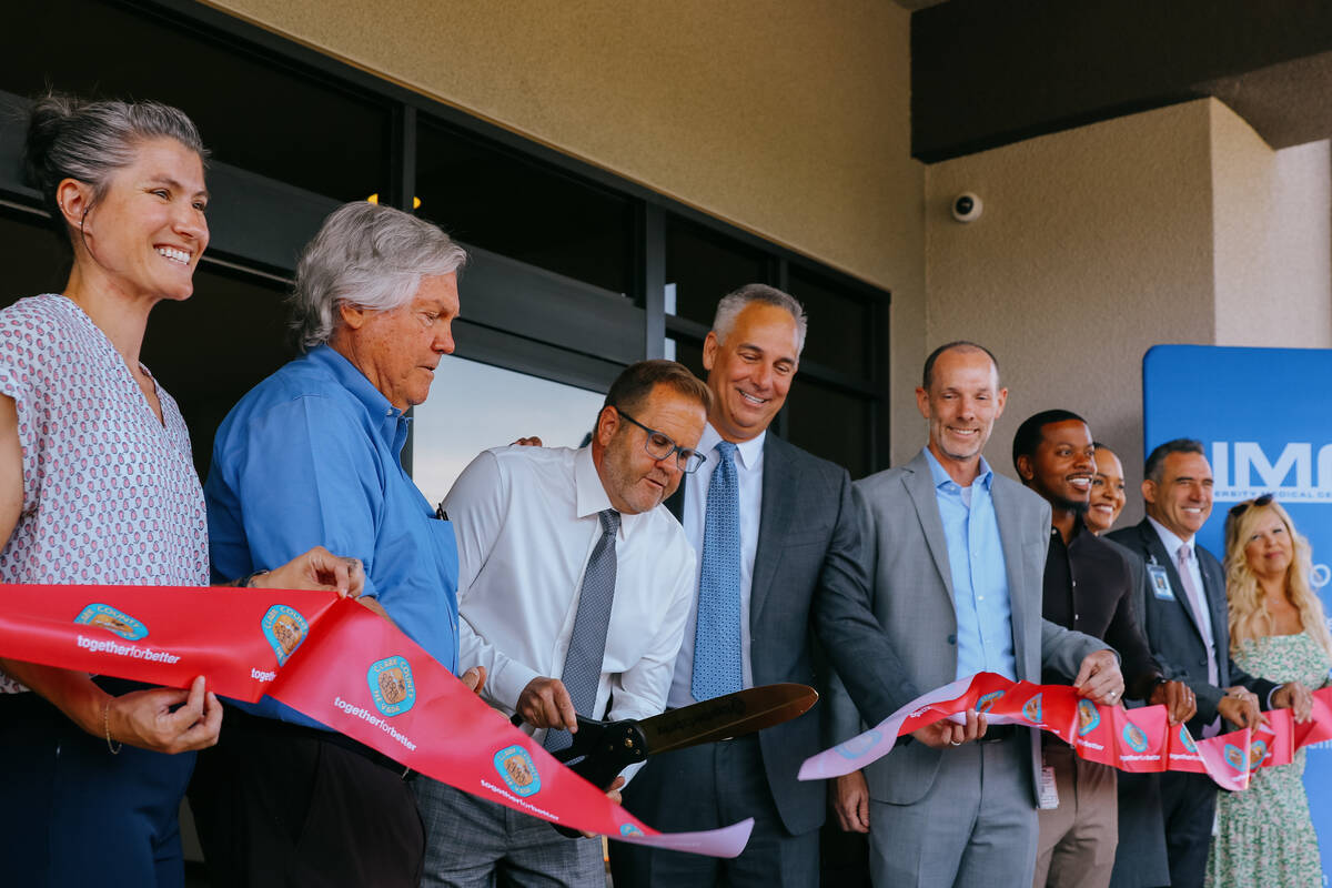 Clark County Manager Kevin Schiller, center, cuts the ribbon on the new Crisis Stabilization Ce ...