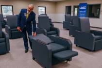 Bud Schawl, Executive Director of UMC Post-Acute Care Services, demonstrates how the chairs in ...