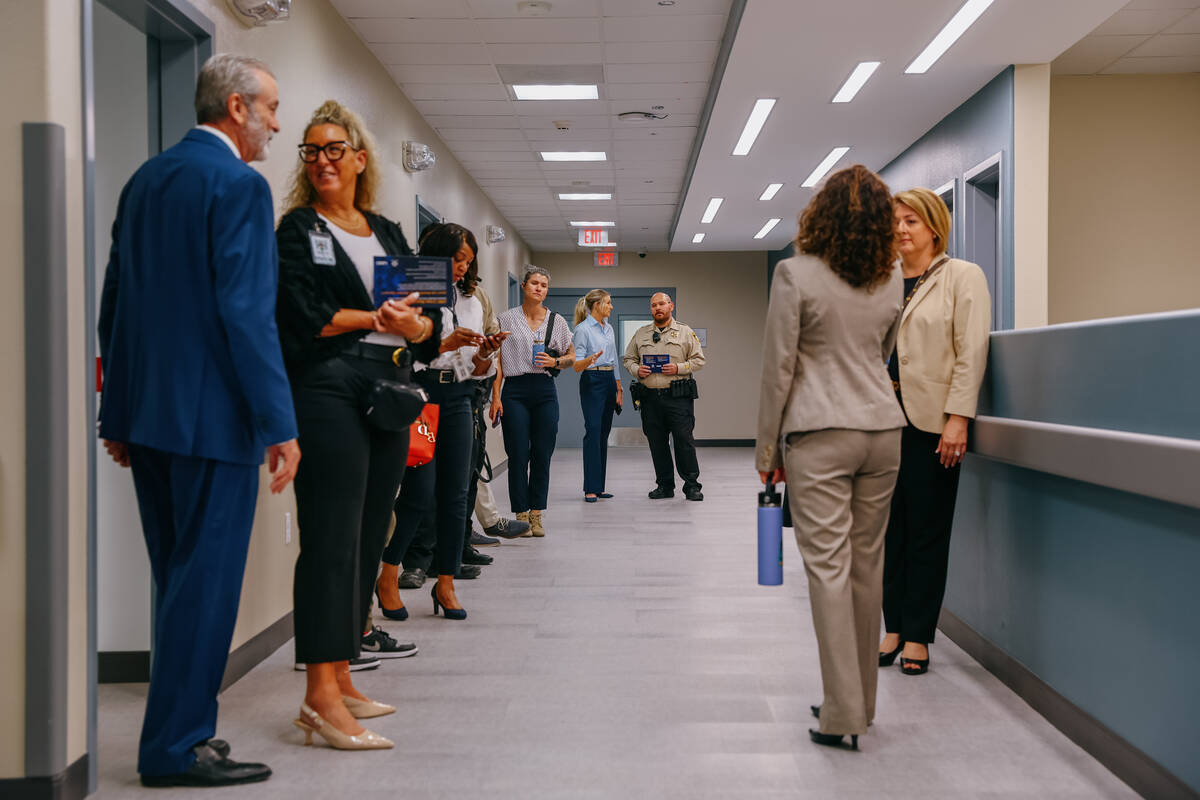 People tour the new Crisis Stabilization Center on Tuesday, June 24, 2025, in North Las Vegas. ...