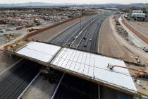 Crews pour concrete on the new Peace Way Bridge over the 215 Beltway, on Saturday, March 1, 202 ...