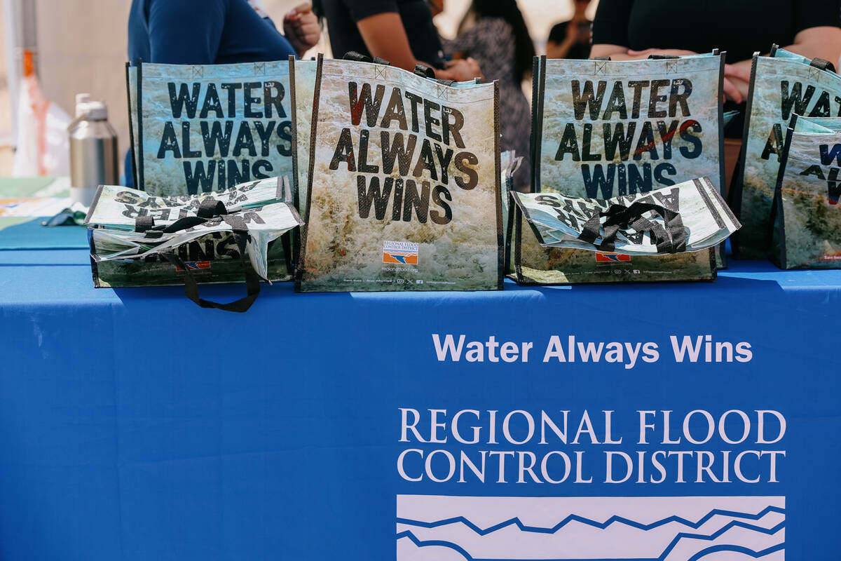 Regional Flood Control District swag bags with the message, “water always wins” s ...