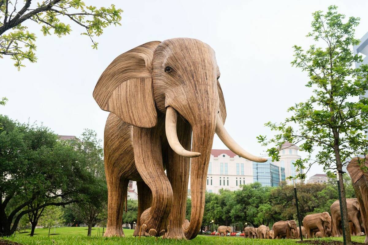 A wooden elephant looms large at an installation along the journey in Houston, Texas. (Courtesy ...