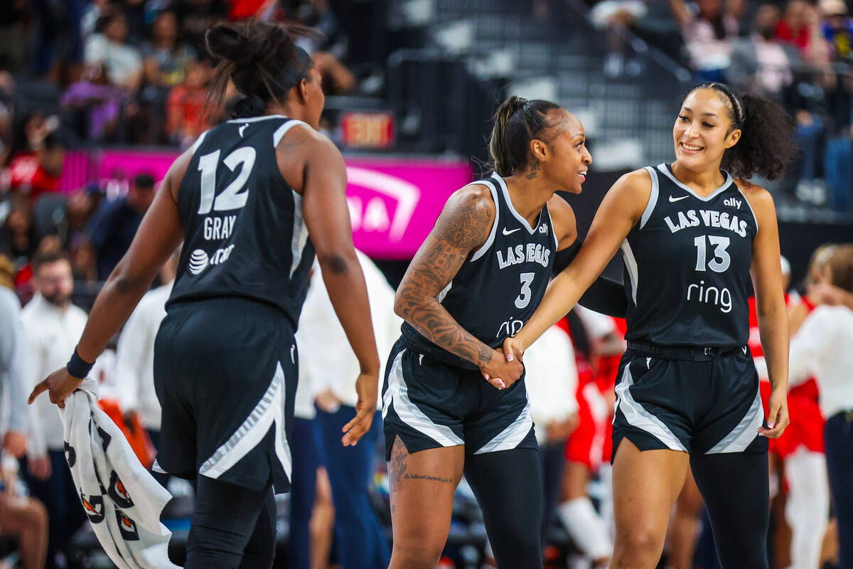 Aces guard Aaliyah Nye (13) is celebrated by her teammates after making a three point shot duri ...