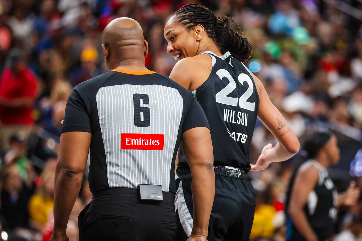 Aces center A'ja Wilson (22) tries to reason with a referee during a WNBA basketball game betwe ...