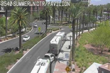 A Metropolitan Police Department vehicle is between two RTC buses Tuesday, June 17, 2025, outsi ...