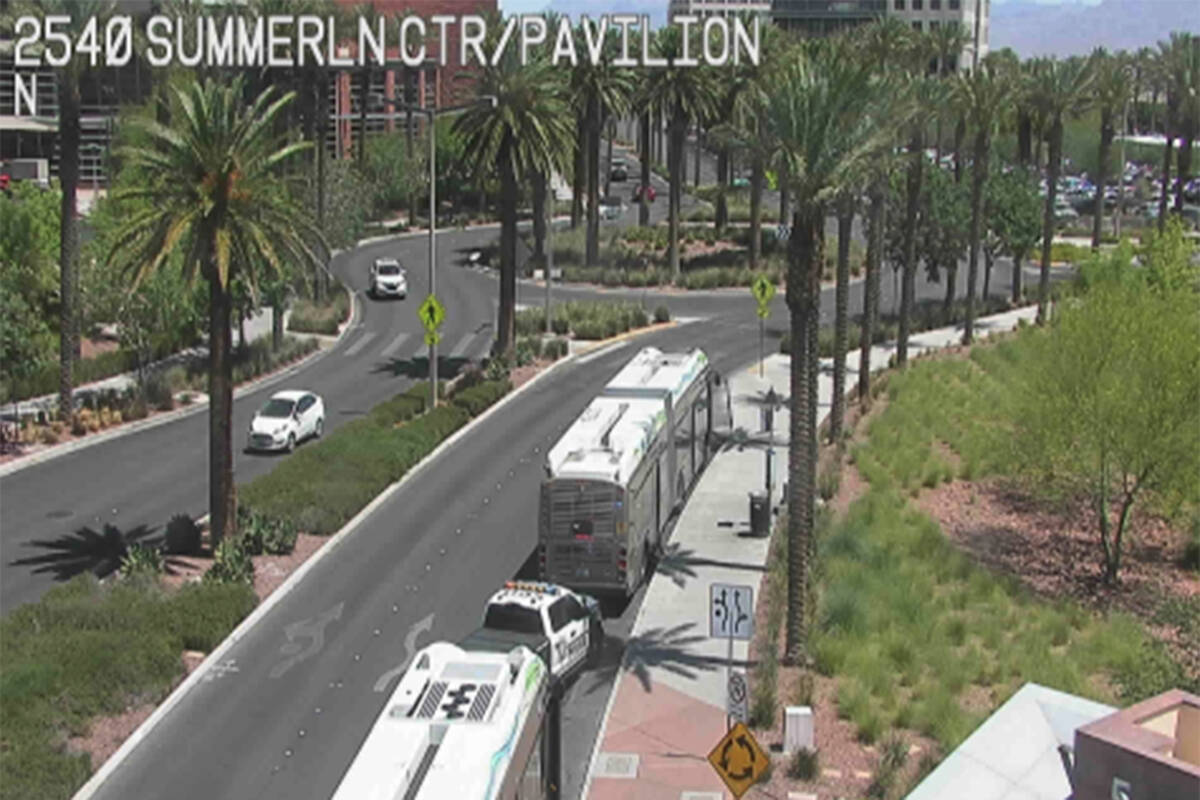 A Metropolitan Police Department vehicle is between two RTC buses Tuesday, June 17, 2025, outsi ...