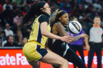Aces guard Tiffany Mitchell (3) dribbles the ball as Los Angeles Sparks forward Dearica Hamby ( ...
