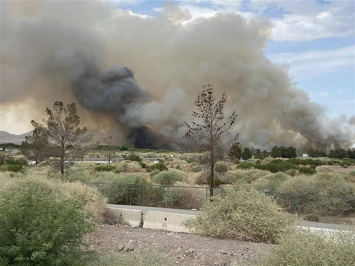 A fire at Clark County Wetlands Park is seen Tuesday, June 24, 2025, in Las Vegas. (Bryan Horwa ...